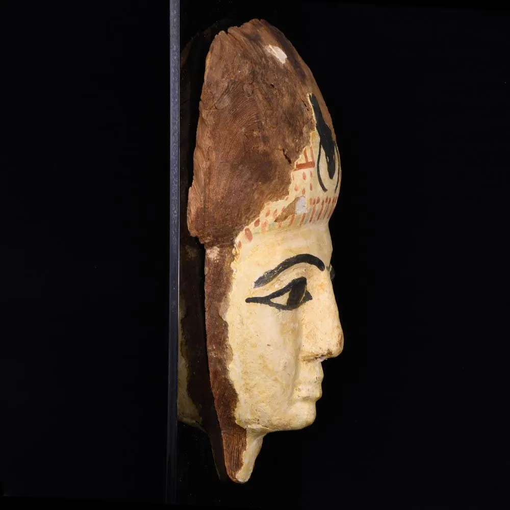 An Egyptian Wooden Mummy Mask, 21st Dynasty, ca. 1069 - 945 BCE