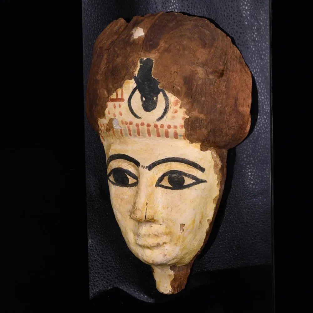 An Egyptian Wooden Mummy Mask, 21st Dynasty, ca. 1069 - 945 BCE