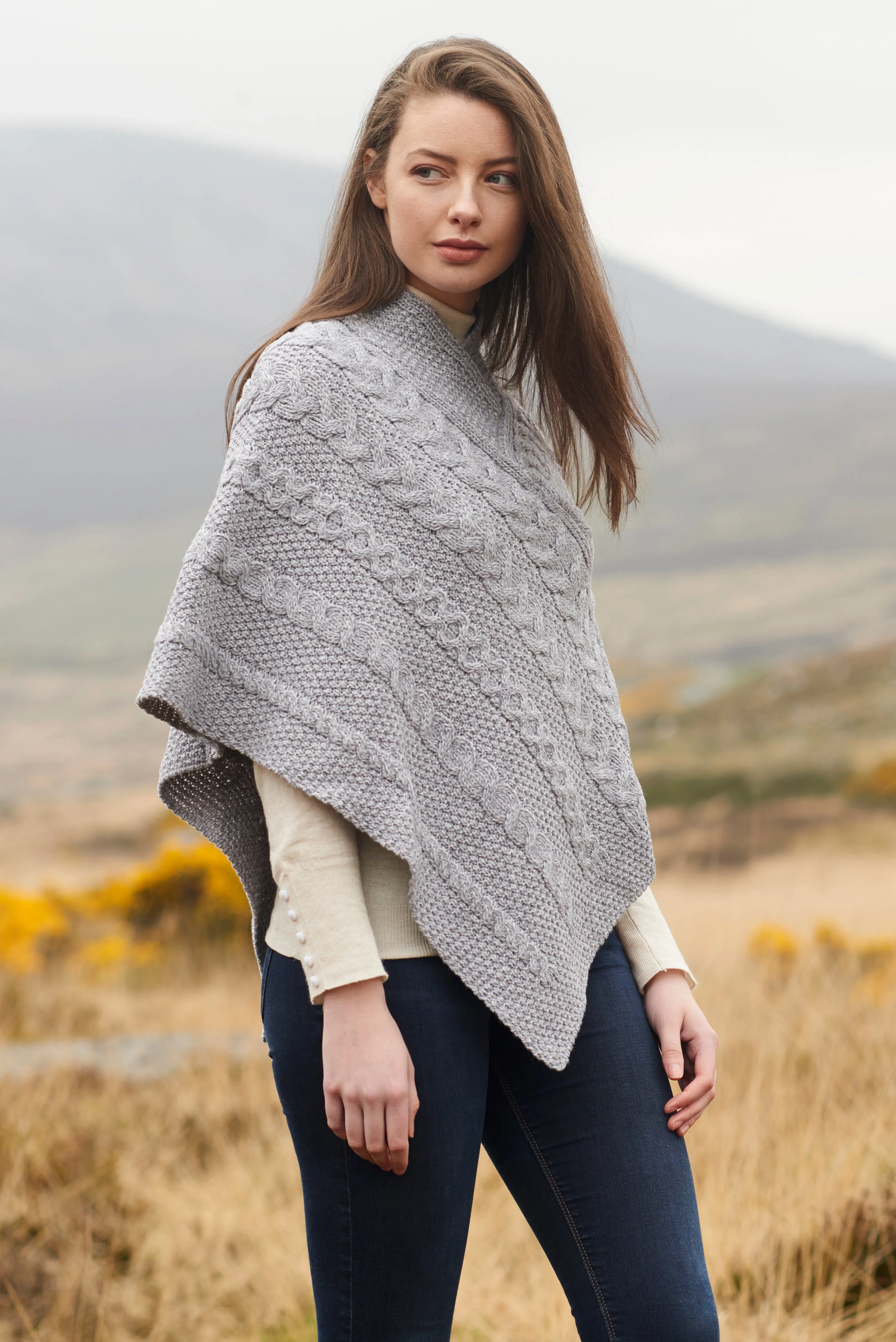 LADIES ARAN PONCHO WITH CABLE AND MOSS STITCHING