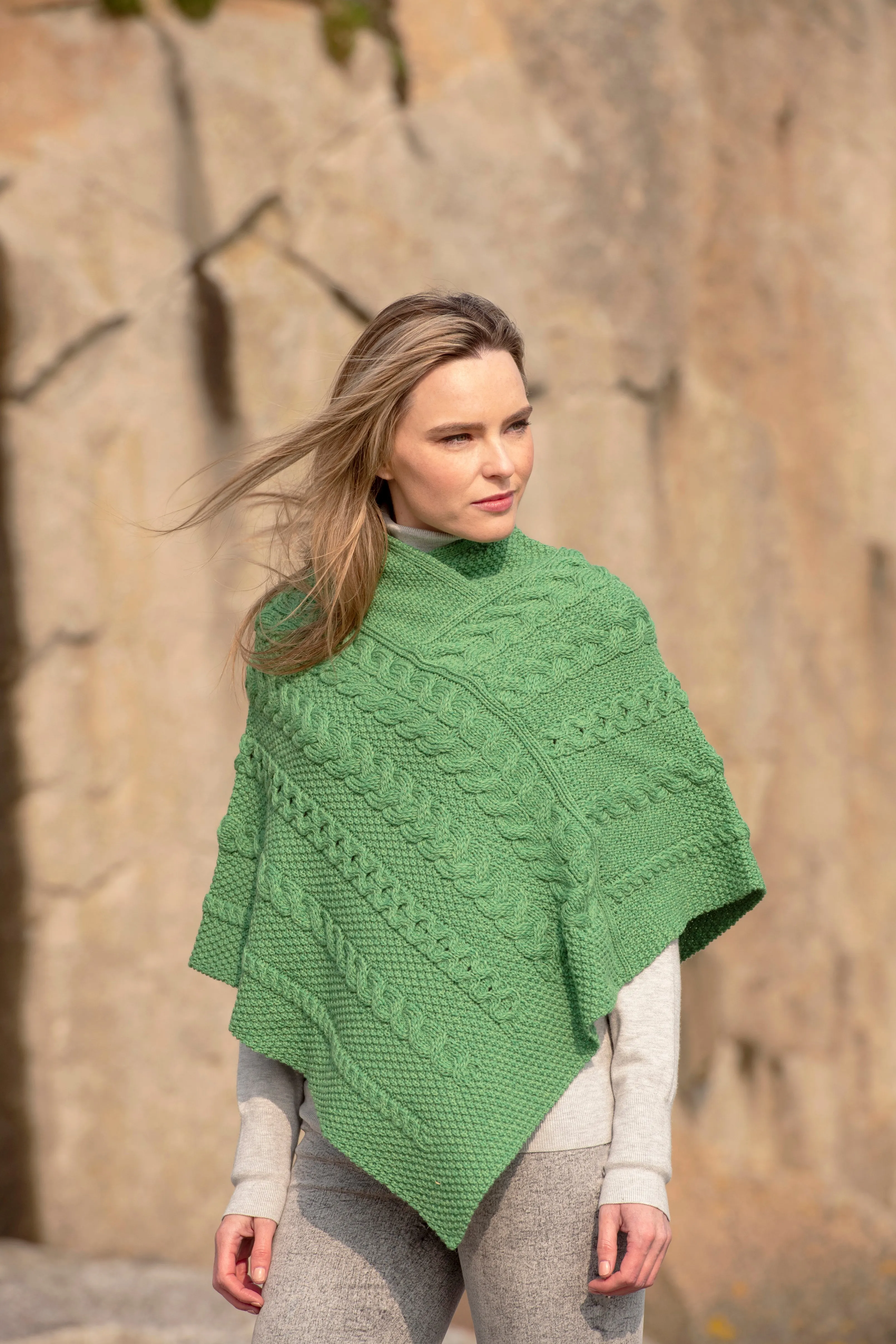 LADIES ARAN PONCHO WITH CABLE AND MOSS STITCHING